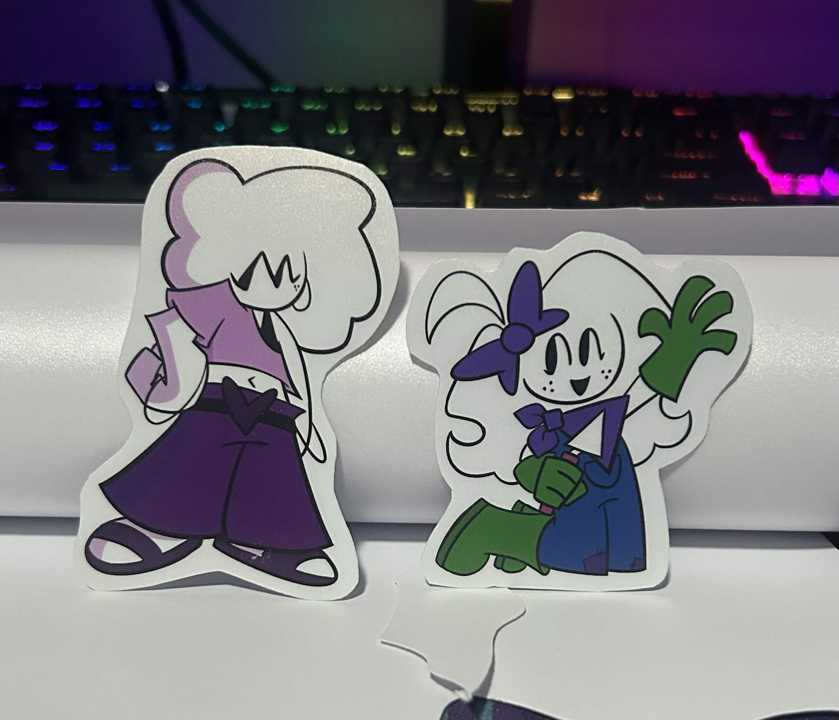 An image of two hand-made stickers based on previous Animoun art